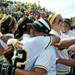 The Michigan team embraces and celebrates defeating Louisiana-Lafayette 2-1 on Saturday, May 25. Daniel Brenner I AnnArbor.com